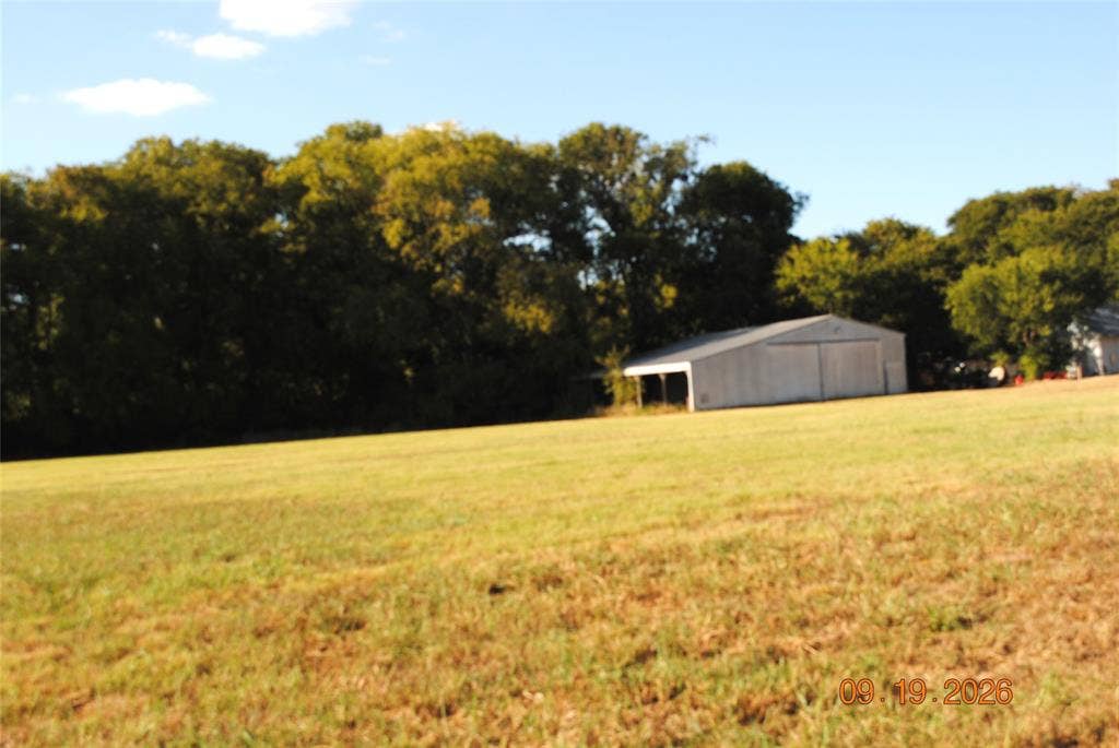 2300 W MAIN Street, Lancaster, TX 75146 Large utility barn is near front corner of property.
