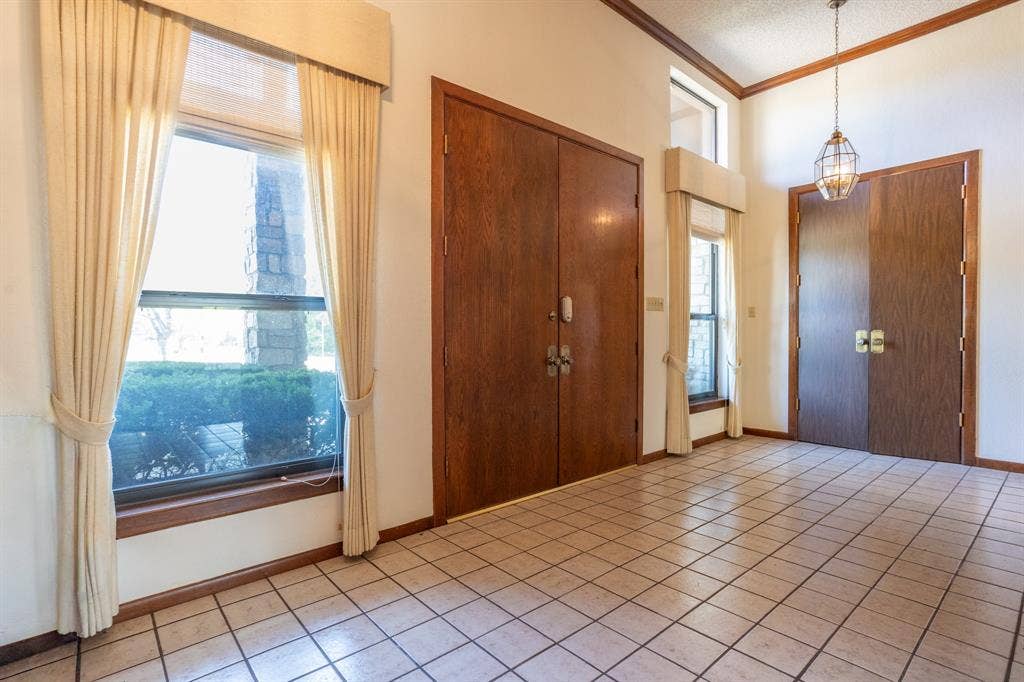 2300 W MAIN Street, Lancaster, TX 75146 Grand entry with tall doors and closets on each side.