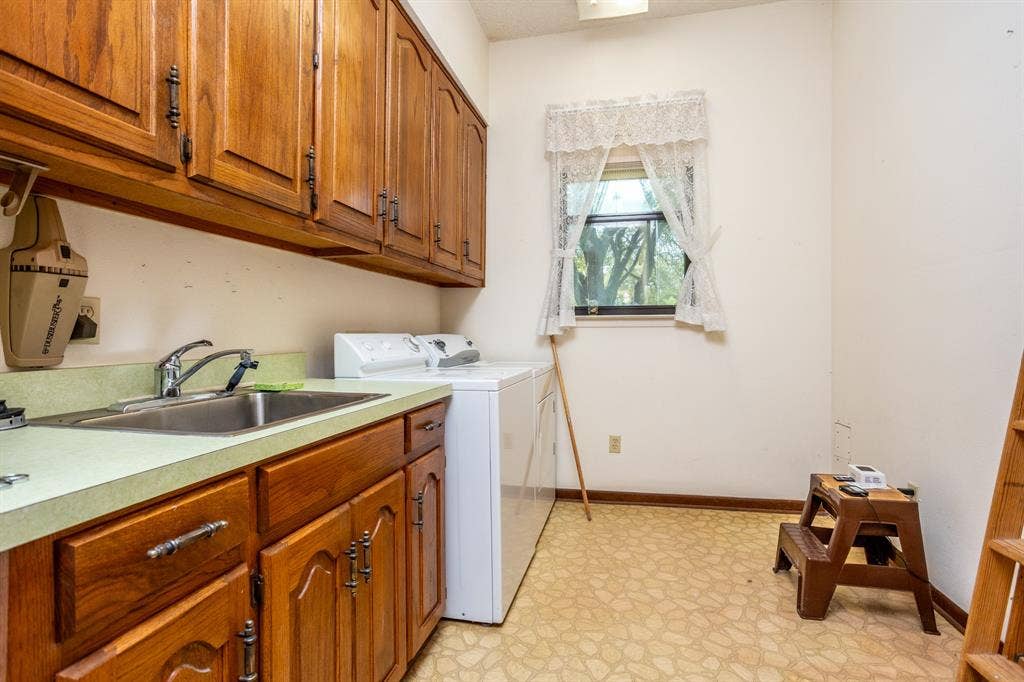 2300 W MAIN Street, Lancaster, TX 75146 Utility offers storage and space for freezer. Located by side door.