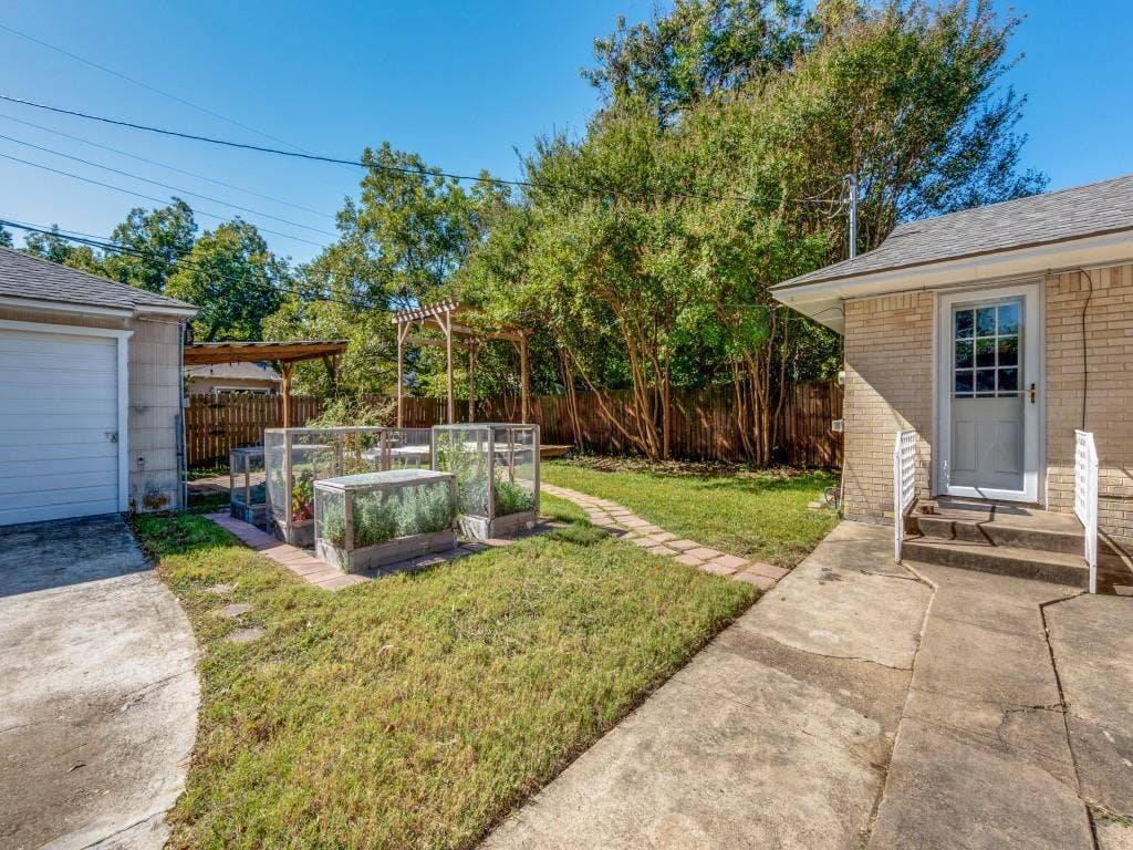 6150 Ravendale Lane, Dallas, TX 75214 Backyard with two car garage