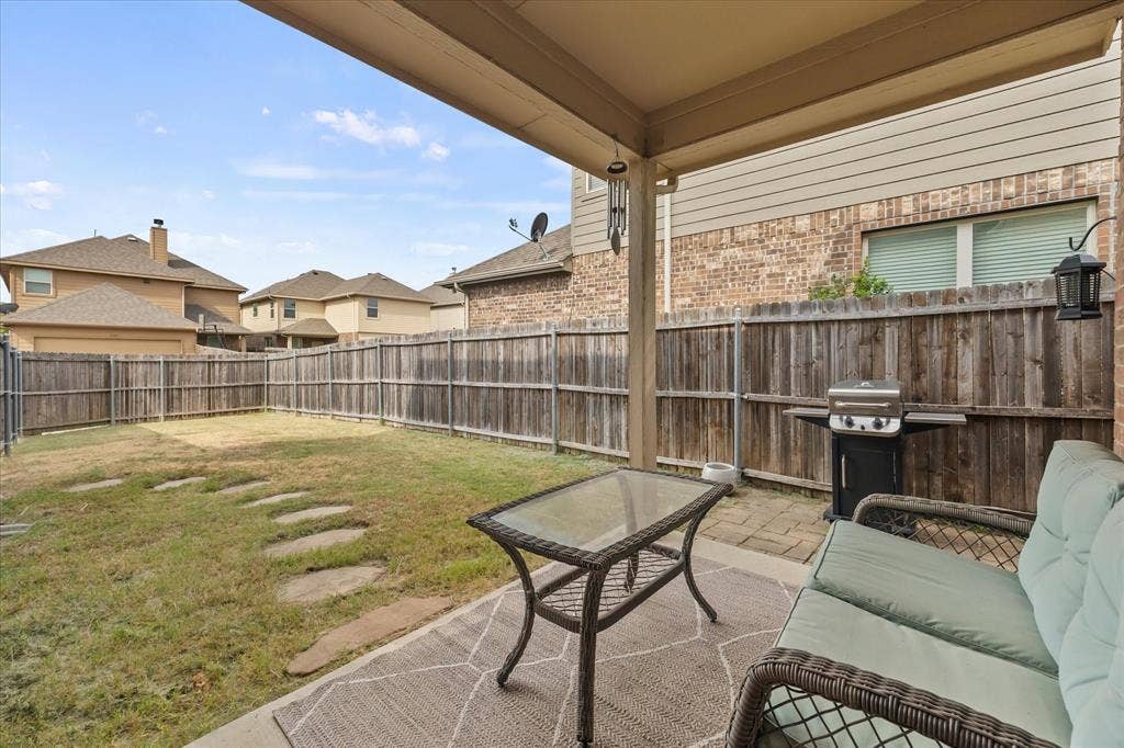 1225 Honeywood Lane, Royse City, TX 75189 Covered patio with concrete flooring, wood privacy fence, and stepping stone path