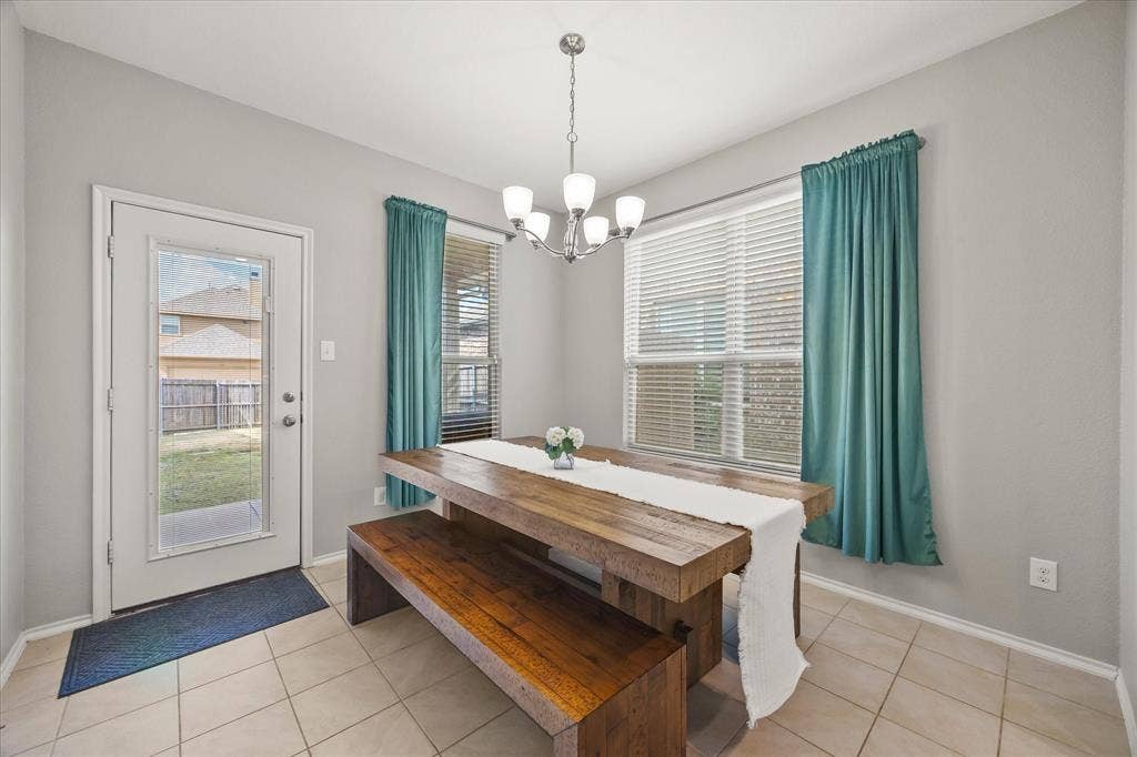 1225 Honeywood Lane, Royse City, TX 75189 Tile flooring, a full-lite exterior door, and a multi-light chandelier