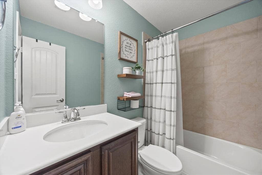 1225 Honeywood Lane, Royse City, TX 75189 White vanity countertop with an integrated sink and chrome faucet