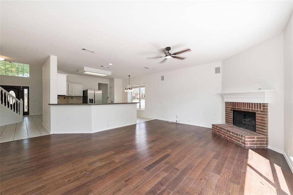 11443 Waterford Lane, Frisco, TX 75035 Wood-finish flooring throughout the main living space