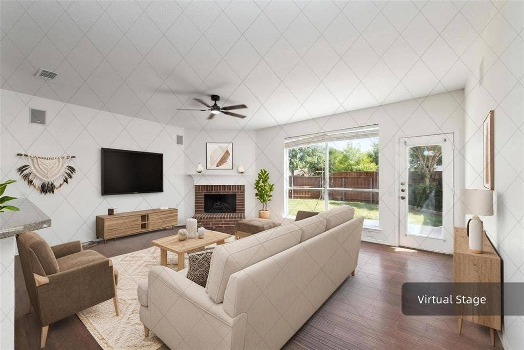 11443 Waterford Lane, Frisco, TX 75035 Vaulted ceiling with a ceiling fan, brick fireplace with a mantel, wood-finish flooring, large window, and a glass-paned door