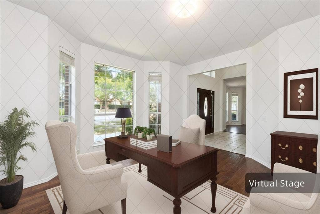 11443 Waterford Lane, Frisco, TX 75035 Hardwood flooring, bay windows, recessed ceiling light, arched doorway, and white wall finishes