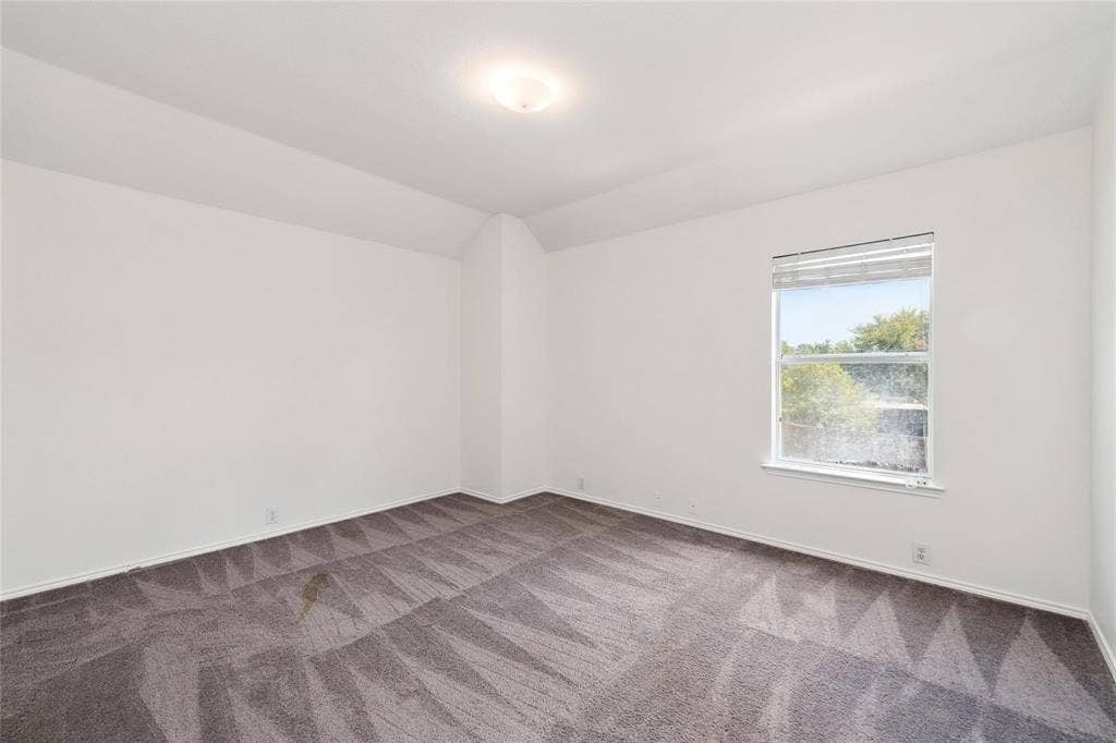 11443 Waterford Lane, Frisco, TX 75035 Recessed ceiling light fixture, framed window, and patterned carpet