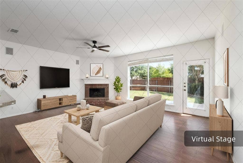 11443 Waterford Lane, Frisco, TX 75035 Hardwood-finish flooring, brick fireplace with mantel, ceiling fan with integrated lighting, glass-paneled exterior door, and large window