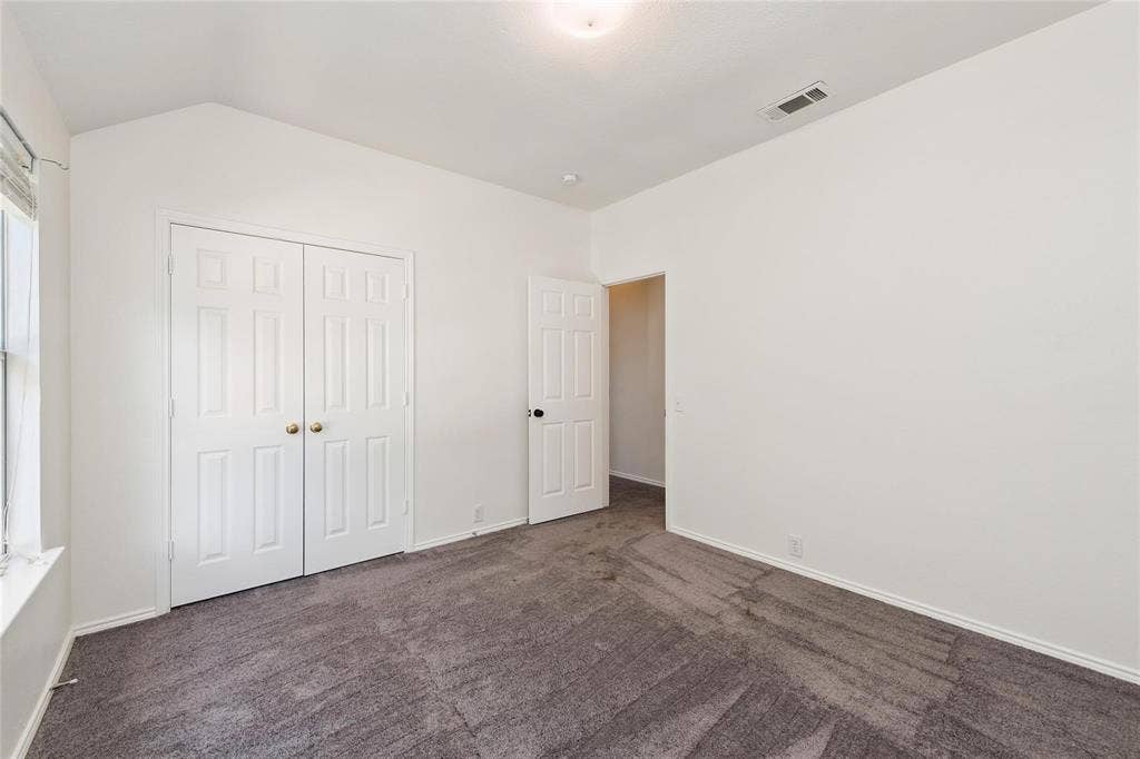 11443 Waterford Lane, Frisco, TX 75035 Vaulted ceiling with a flush-mount light fixture