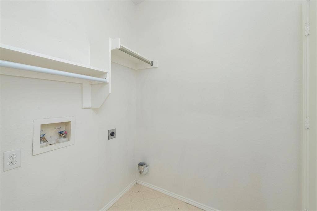 11443 Waterford Lane, Frisco, TX 75035 Laundry area featuring a utility sink connection, built-in shelving, and a hanging rod