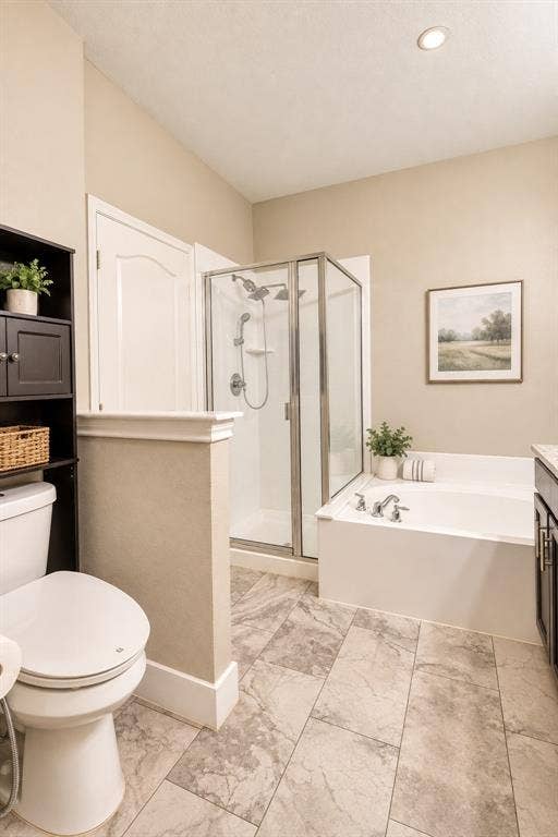 6854 Cortona Lane, Frisco, TX 75034 Bathroom featuring a walk-in shower with glass enclosure, separate soaking tub, and tile flooring