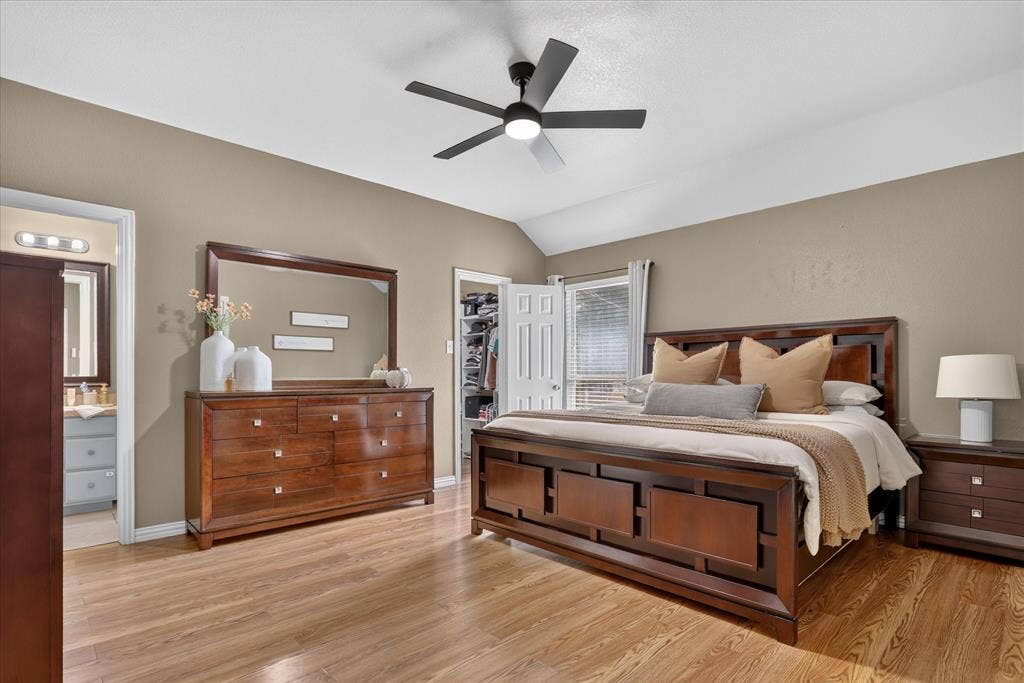 5413 Cornell Avenue, River Oaks, TX 76114 Vaulted ceiling, wood-finish flooring, ceiling fan, and window with blinds