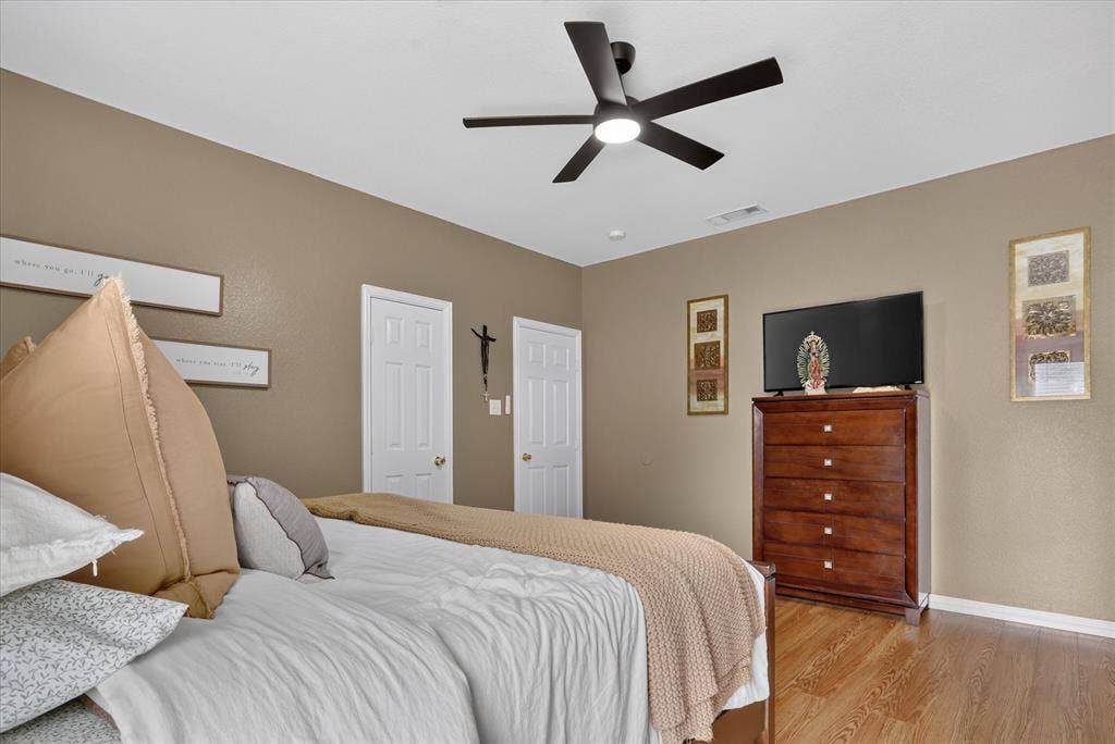5413 Cornell Avenue, River Oaks, TX 76114 Recessed lighting, wood-finish flooring, ceiling fan with integrated lighting, and multiple interior doors