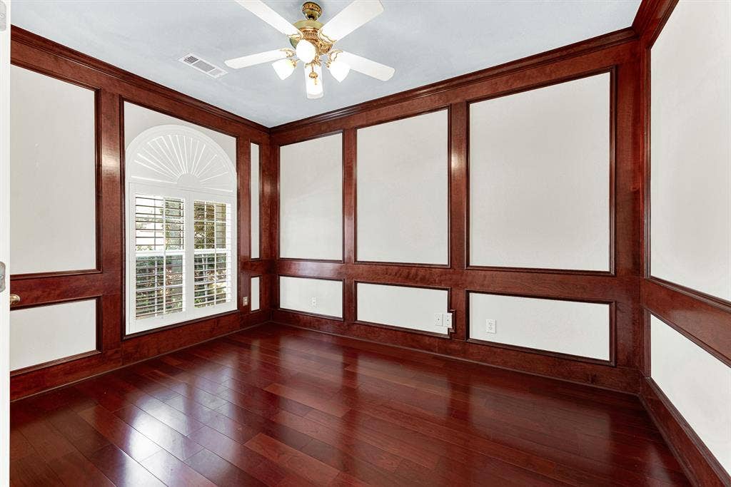 4020 MAYFLOWER Lane, Plano, TX 75024 Rich wood millwork frames an arched sunburst window that pours sunlight across deep hardwood planks. Settle in with a notebook and steaming espresso to tackle your morning tasks in peace.