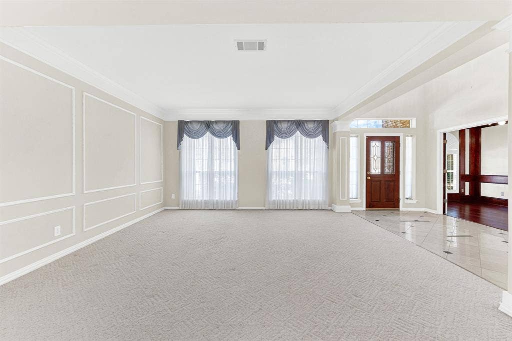 4020 MAYFLOWER Lane, Plano, TX 75024 Clean wall paneling and dual framed windows establish a balanced, symmetrical backdrop bathed in natural daylight. This versatile layout invites you to kick off your shoes and enjoy casual family game nights.