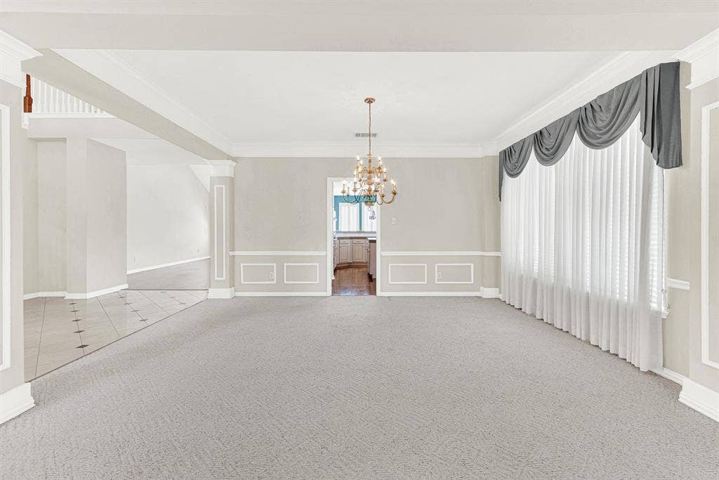 4020 MAYFLOWER Lane, Plano, TX 75024 Generous picture windows draped in soft shear curtains filter gentle, ambient light across the refined wall molding. You can easily picture setting a large table under the chandelier for memorable holiday feasts.