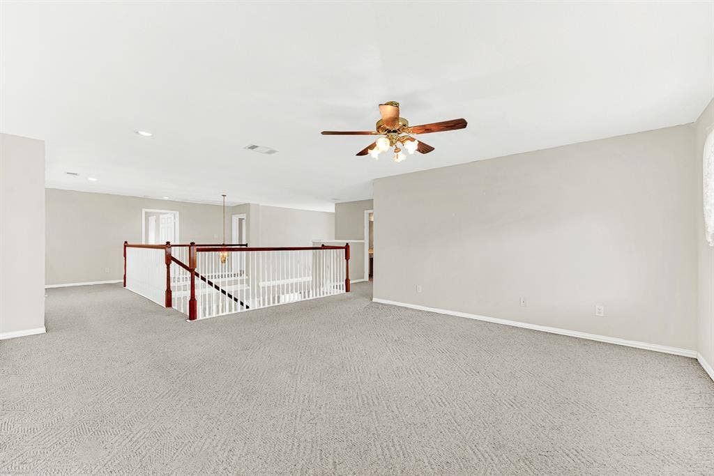 4020 MAYFLOWER Lane, Plano, TX 75024 An open banister overlook keeps the second-floor flex space connected to the foyer below. Enjoy seamless traffic flow and an airy overhead feel throughout the upper level.
