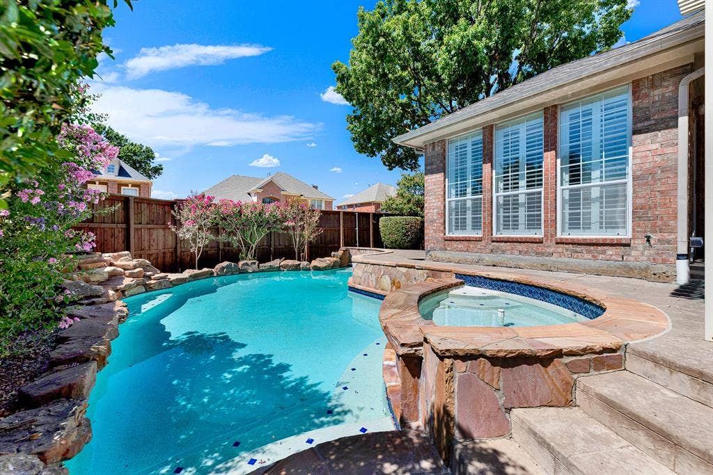 4020 MAYFLOWER Lane, Plano, TX 75024 A sparkling in-ground pool and integrated raised spa are surrounded by natural stone coping and lush greenery. Unwind in the bubbling hot tub after a busy workday
