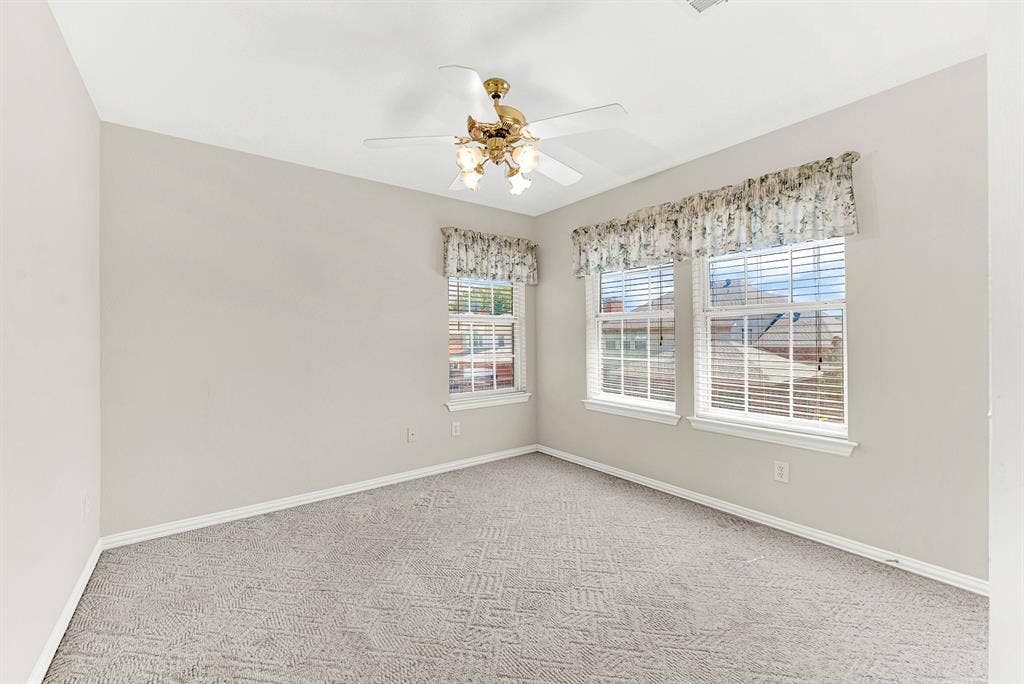 4020 MAYFLOWER Lane, Plano, TX 75024 Plush carpeting and dual sunlit windows define this quiet private bedroom sanctuary. A cozy space to unwind, read, or catch a restful night's sleep