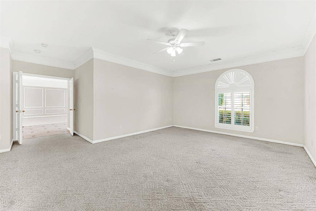 4020 MAYFLOWER Lane, Plano, TX 75024 Double doors lead seamlessly out toward the foyer, highlighting the generous floor layout. Imagine slipping away here for a quiet afternoon nap