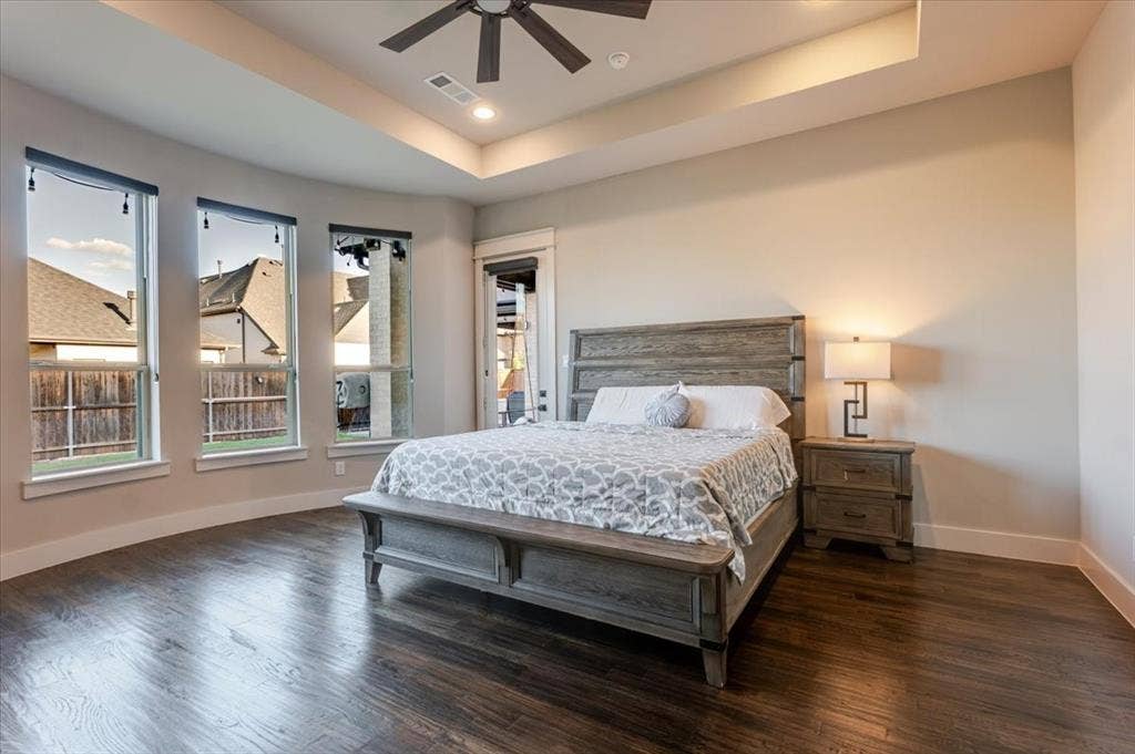 4102 Parkview Boulevard, Celina, TX 75009 Recessed ceiling with an integrated fan, wood-finish flooring, and multiple tall windows