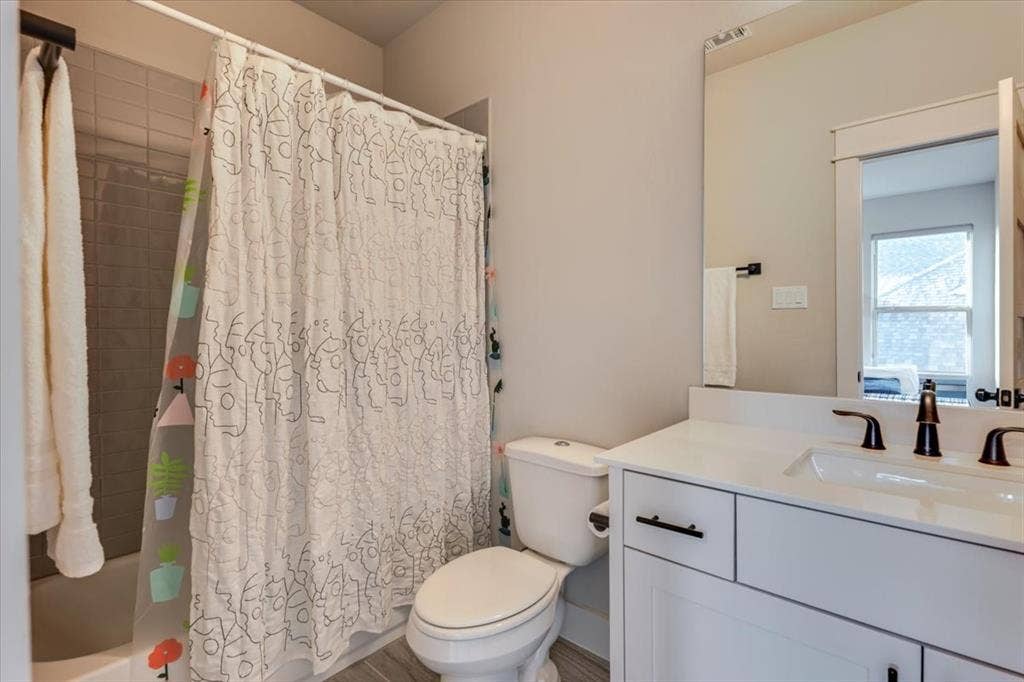4102 Parkview Boulevard, Celina, TX 75009 White vanity with dark hardware, undermount sink, and white countertop