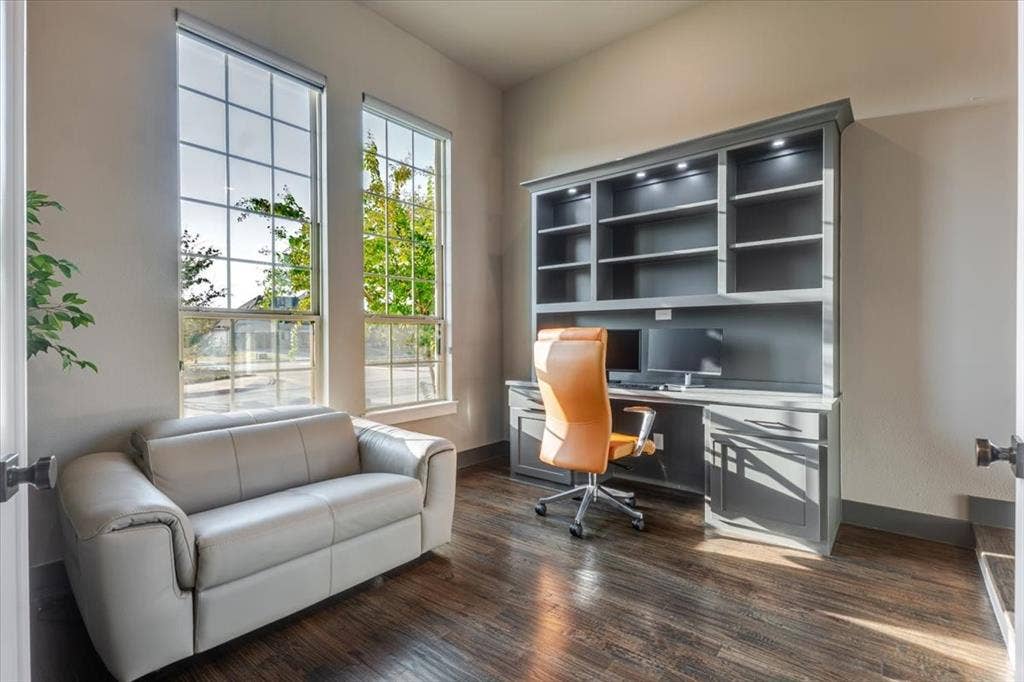 4102 Parkview Boulevard, Celina, TX 75009 Built-in shelving with integrated lighting, wood-finish flooring, tall windows with grid patterns, and neutral wall tones