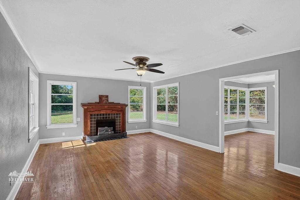 3749 Bobbitt Drive, Shreveport, LA 71107 Warm wood floors with multiple windows to bathe the room in natural light