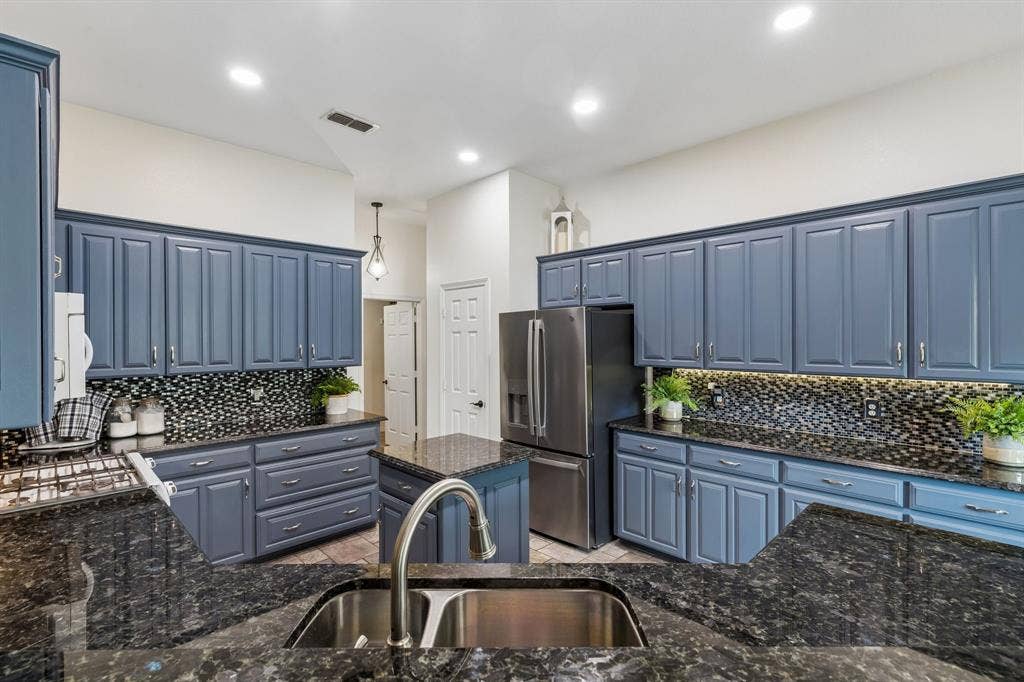 Thoughtful Layout With Center Island, Ample Storage, And Open Flow