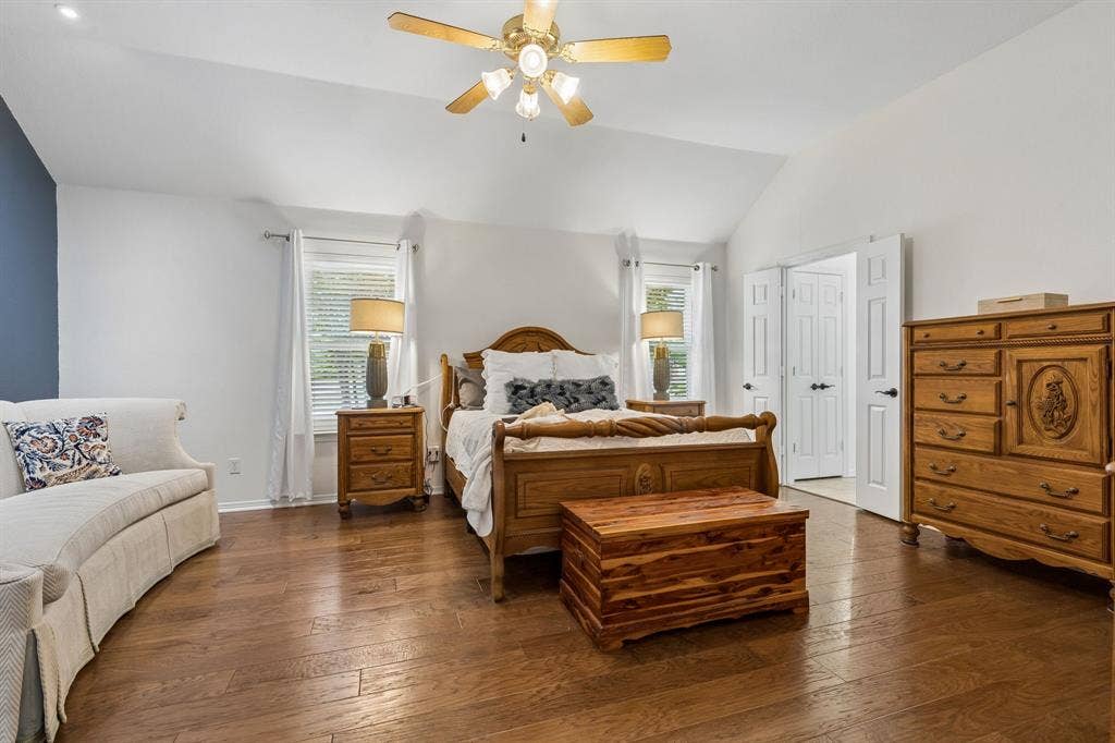 Spacious Primary Suite With Wood Floors, Vaulted Ceilings, And Natural Light