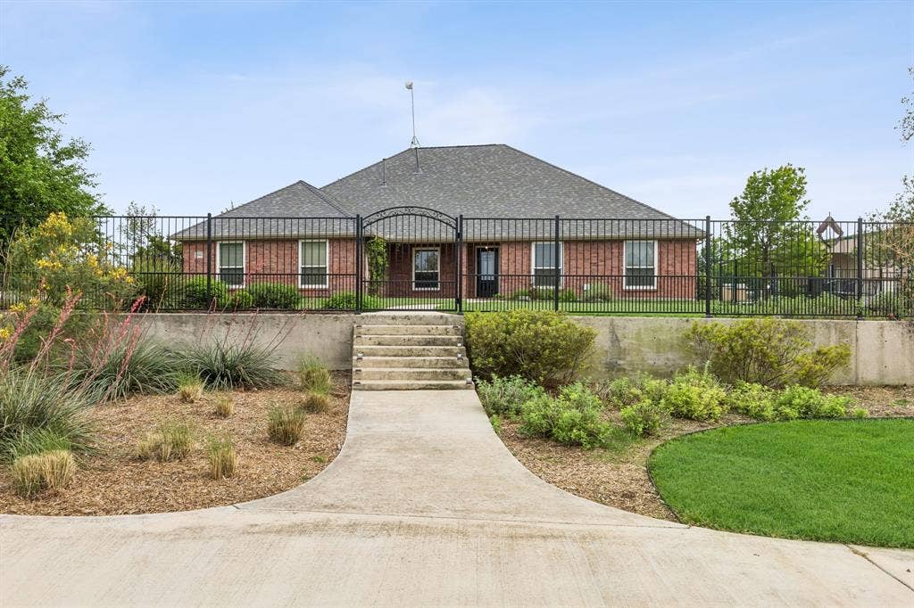 Beautiful Elevated Lot With Manicured Grounds And Wrought Iron Fence