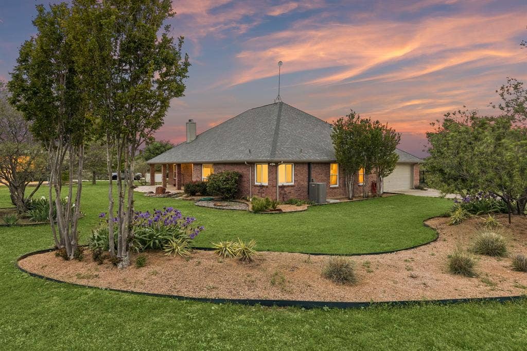 Lush Grounds With Gardens And Serene Sunset Views