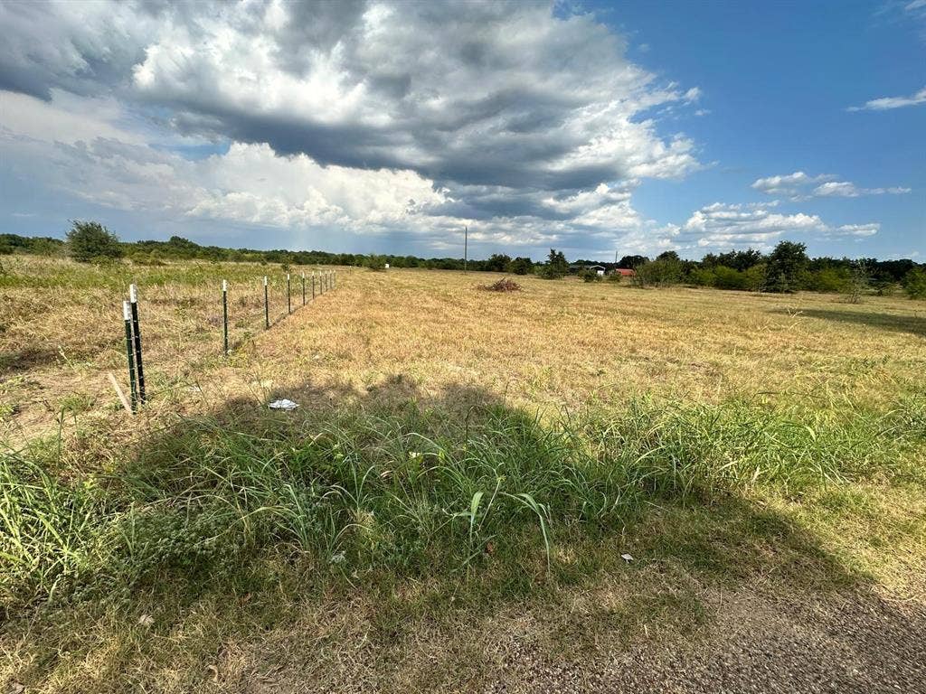 12496 County Road 2148, Kemp, TX 75143 Expansive open field with partial fencing and distant tree line