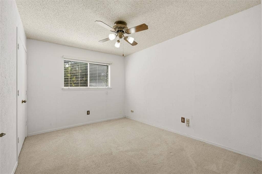 1512 Woodcreek Drive, Richardson, TX 75082 Neutral wall finishes, carpet flooring, a ceiling fan with integrated lighting, and a window with blinds