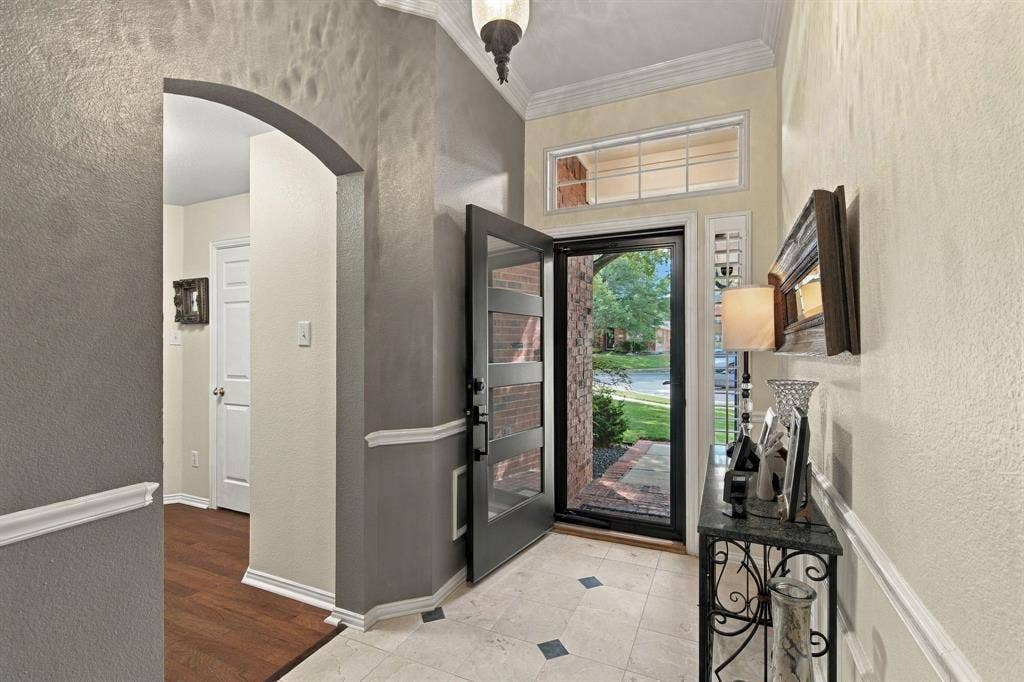 3106 Morning Dove, McKinney, TX 75072 Entryway featuring a decorative front door with multiple glass panes, a transom window, and tiled flooring