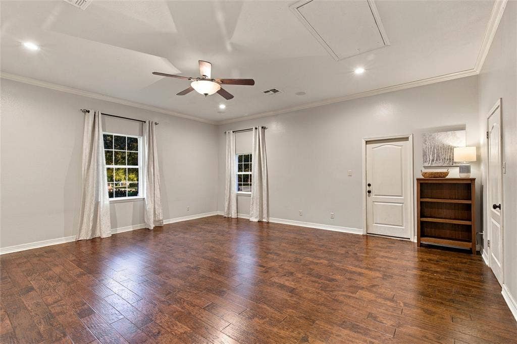 11408 Somerville Drive, Temple, TX 76502 Wood-finish flooring, ceiling fan, recessed lighting, crown molding, and white trim