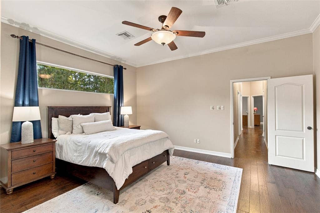 11408 Somerville Drive, Temple, TX 76502 Dark wood-finish flooring with a ceiling fan light fixture