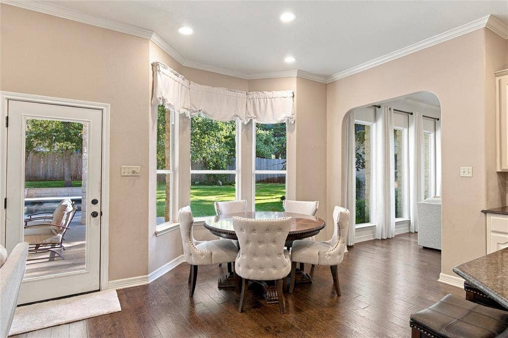 11408 Somerville Drive, Temple, TX 76502 Bay window with multiple glass panels, recessed lighting, wood-finish flooring, and a glass-paneled exterior door