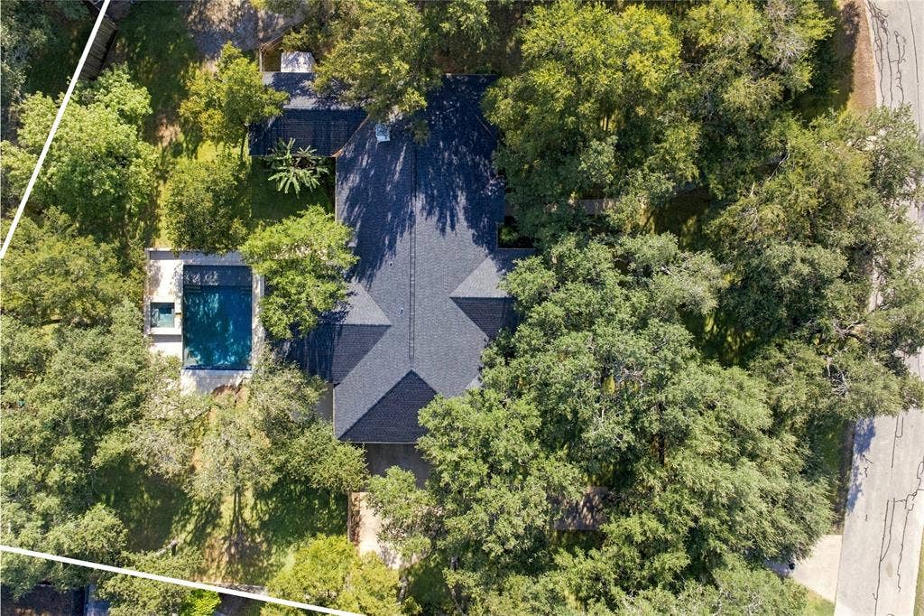 11408 Somerville Drive, Temple, TX 76502 Aerial view showcasing the home surrounded by mature trees, expansive lawn, and a private setting. Lot size 1.0 acre and not all in view.