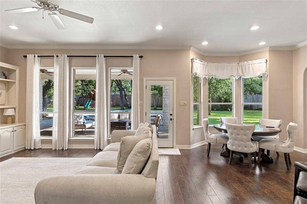 11408 Somerville Drive, Temple, TX 76502 Recessed lighting, crown molding, built-in shelving, wood-finish flooring, and bay window dining area