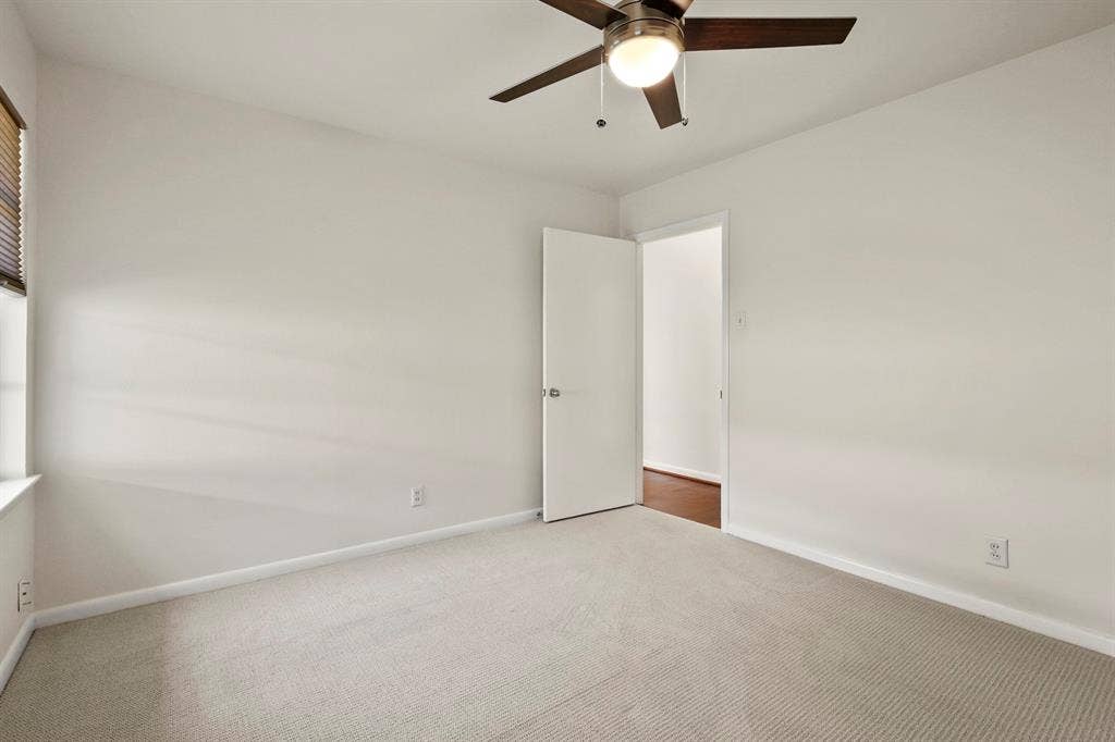 Neutral-toned carpeting throughout