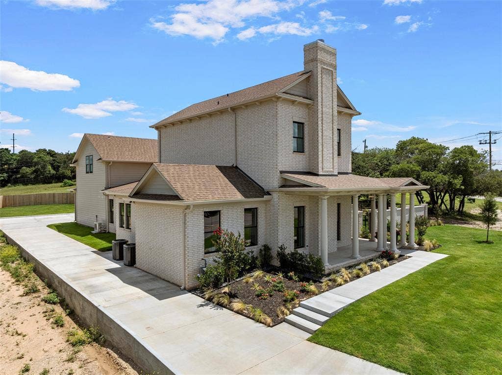 20 N Ritchie Road, Woodway, TX 76712 Light brick exterior with multiple gables and a prominent chimney
