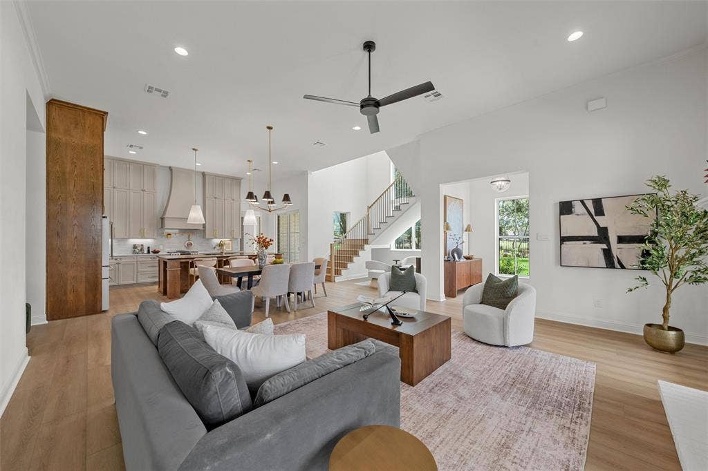 20 N Ritchie Road, Woodway, TX 76712 Open-concept living space featuring high ceilings, wood-finish flooring, and recessed lighting