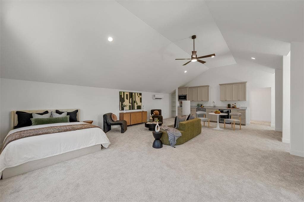 20 N Ritchie Road, Woodway, TX 76712 Vaulted ceilings with recessed lighting, integrated ceiling fan, light-toned carpeting, built-in cabinetry with sink, and a mini-split HVAC unit