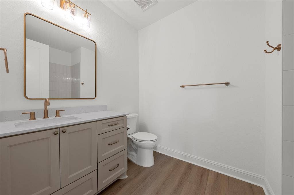 20 N Ritchie Road, Woodway, TX 76712 Vanity with a light countertop, integrated sink, and modern bronze faucet