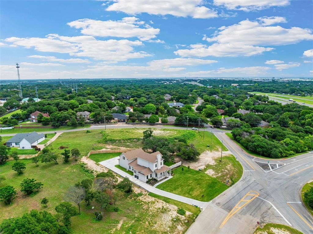 20 N Ritchie Road, Woodway, TX 76712 Aerial perspective showcasing the property's expansive lot, mature trees, and proximity to thoroughfares