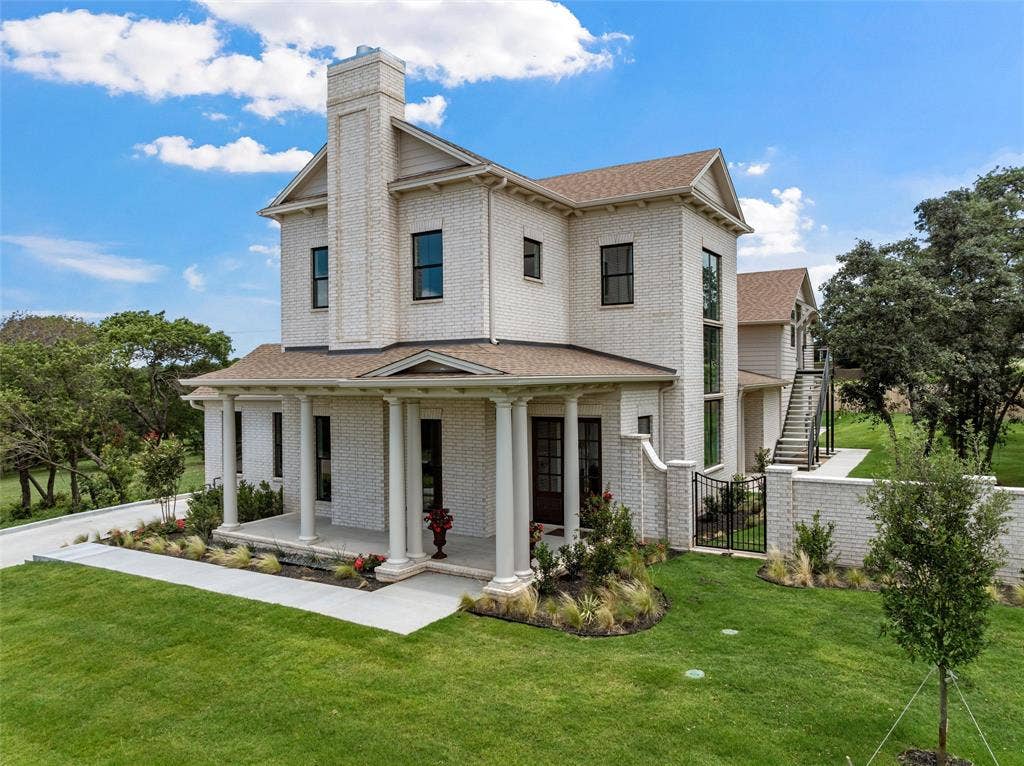 20 N Ritchie Road, Woodway, TX 76712 Brick exterior with a prominent chimney and gable rooflines
