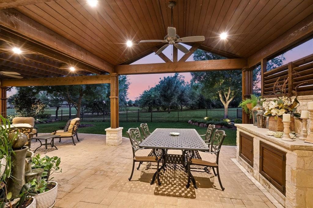 1641 Overwood Drive, Frisco, TX 75036 Priviate Extended patio featuring a gabled wood-finish ceiling with exposed beams, and paver flooring. Great for entertaining.
