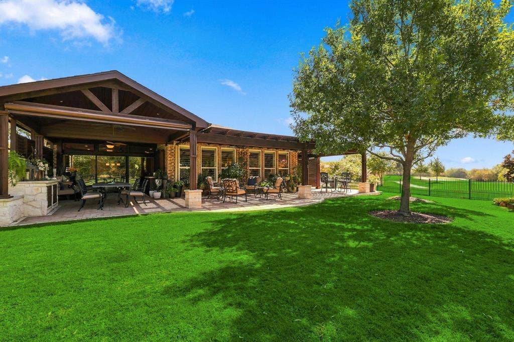 1641 Overwood Drive, Frisco, TX 75036 Backyard Oasis great for entertaining with covered patio featuring a vaulted ceiling and built-in elements, and an additional uncovered patio area