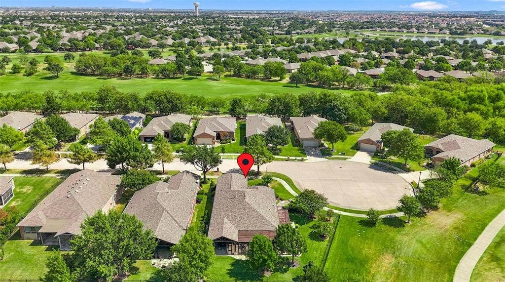 1641 Overwood Drive, Frisco, TX 75036 Residential property with a golf course backdrop, featuring a cul-de-sac street and established landscaping